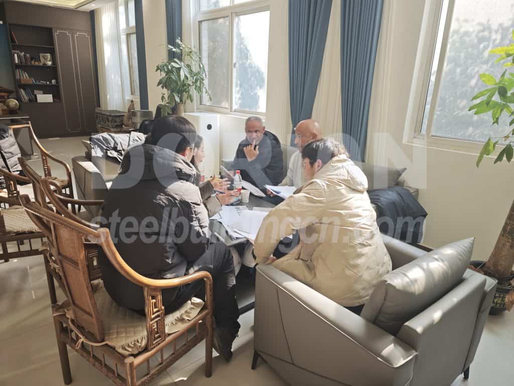 Group of professionals discussing in a bright office space.