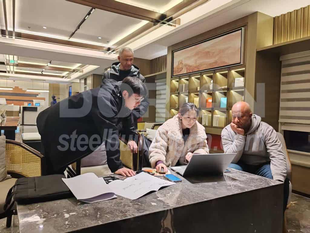 Business team collaborating on project at a modern office table.