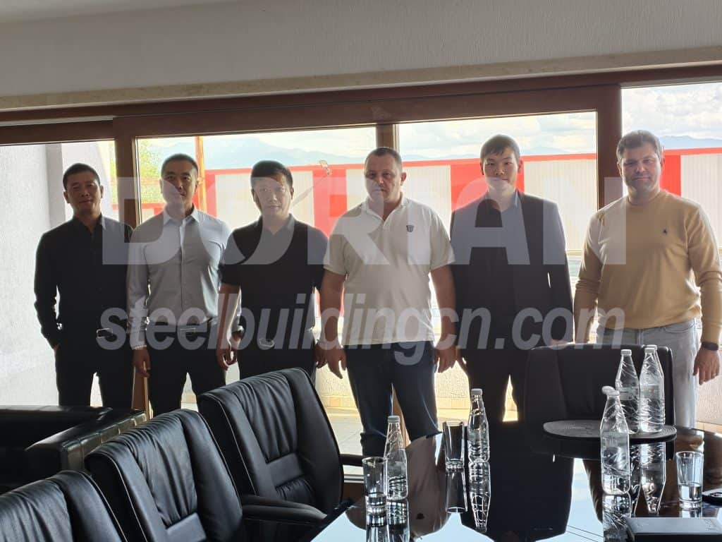 Group of men visiting Dorian factory for project discussion in Oman.