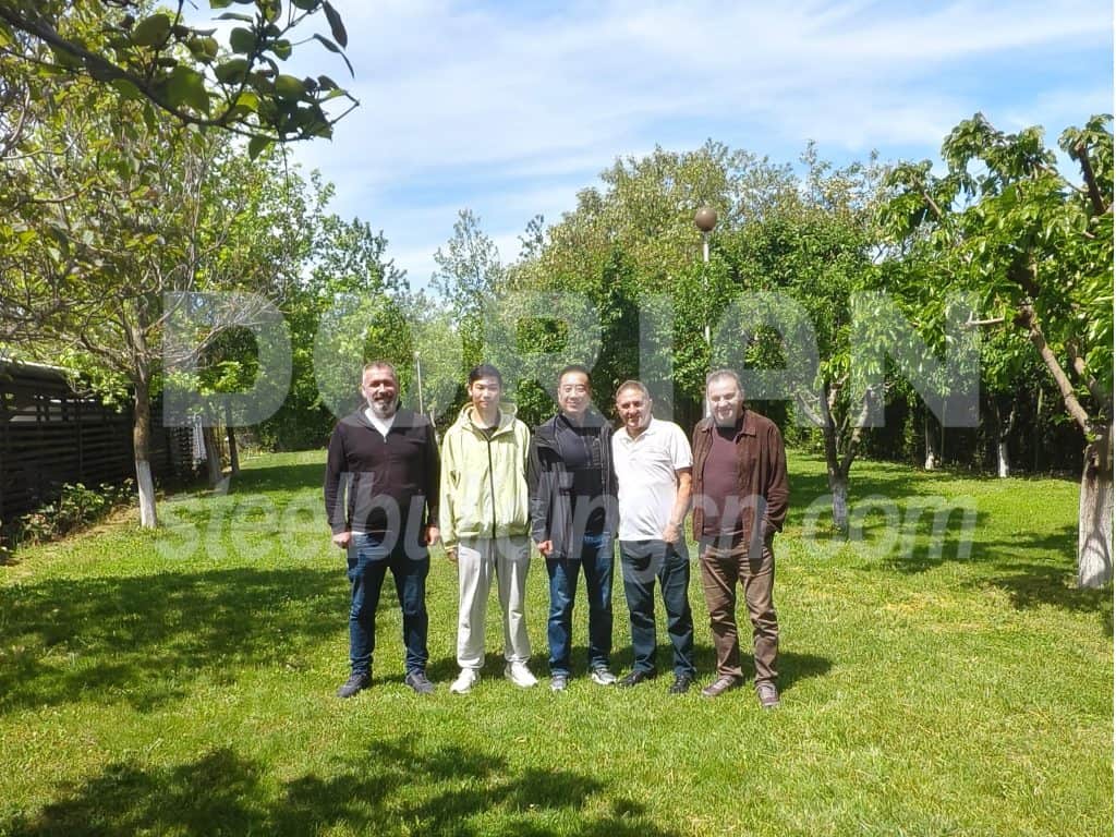 Oman clients visiting Dorian factory for project discussion outdoors.
