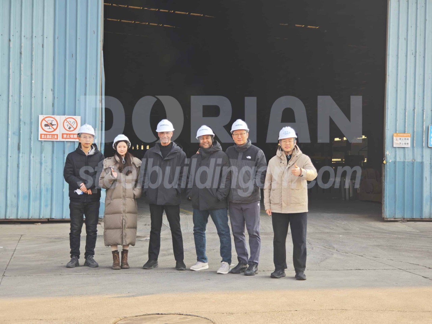 Team of engineers inspecting a steel structure warehouse during a site visit in Muscat, Oman. Steel Structure Warehouse Inspection