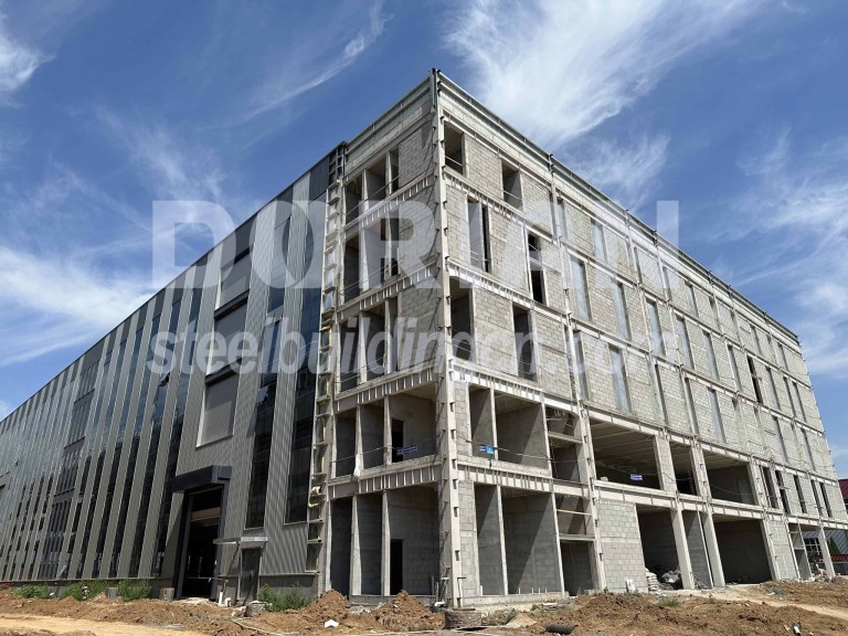A multi-story steel structure office and factory building under construction in China. Steel Building Under Construction