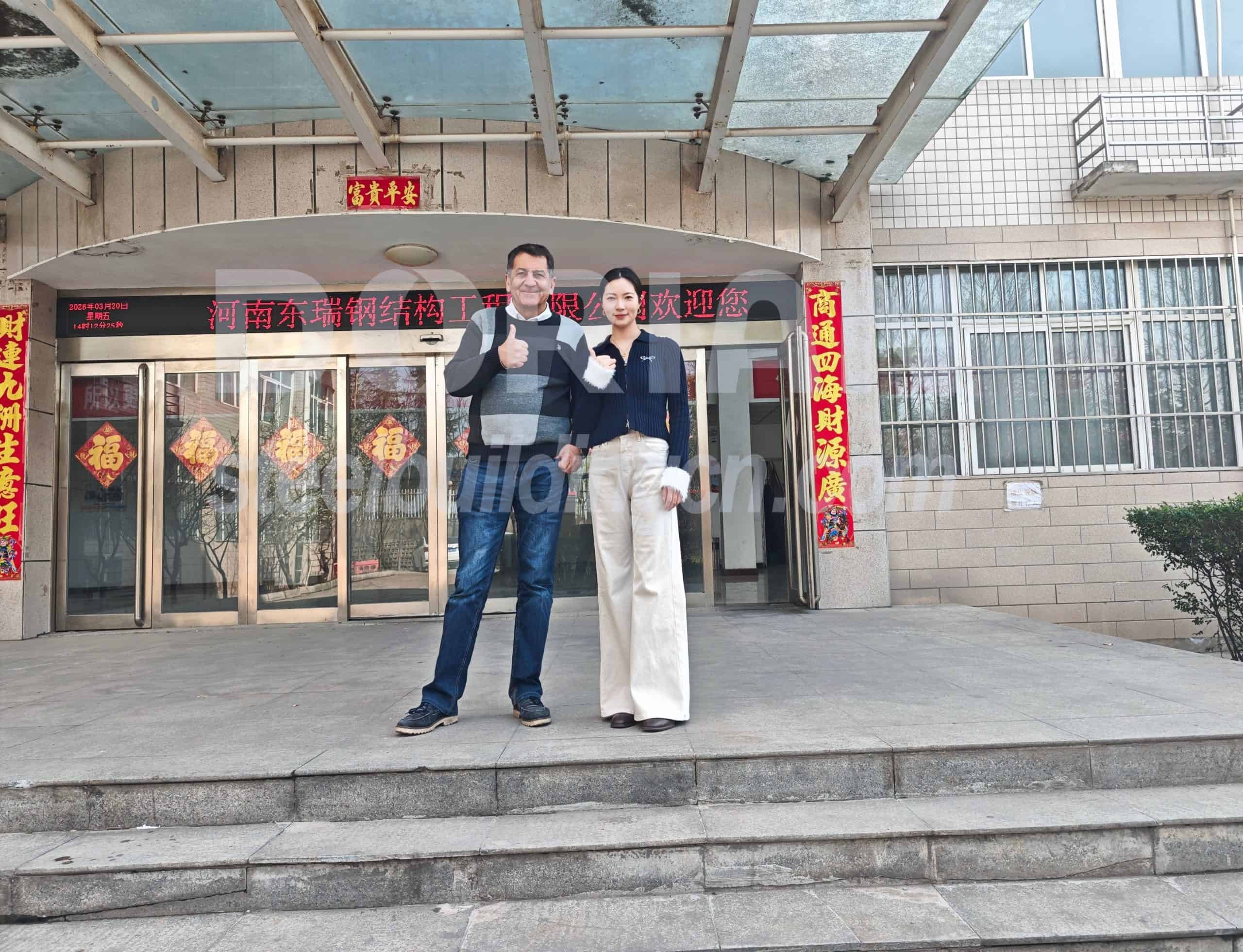 Business professionals outside a contemporary building entrance, showcasing success and teamwork. Welcome Chile Clients to Visit Dorian Factory 03